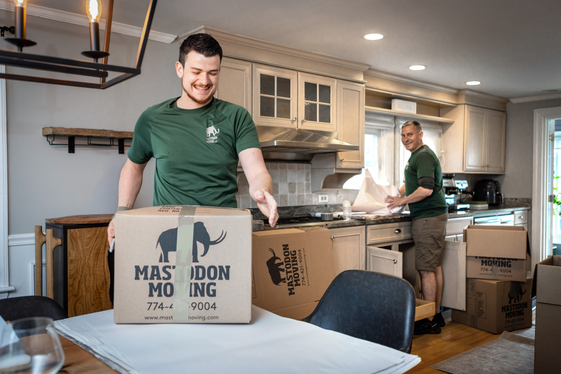 Mastodon Moving team packing a client's kitchen